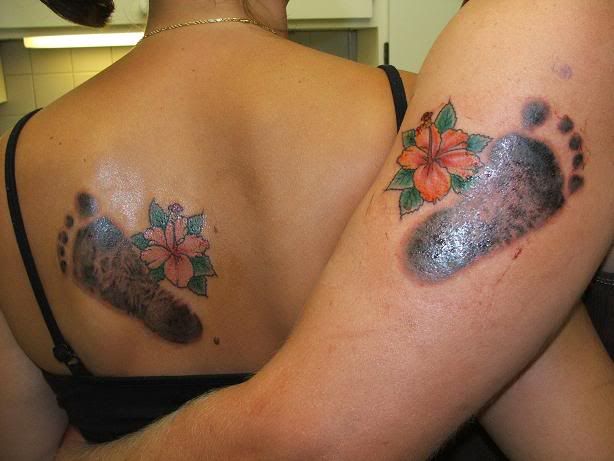 Flower tattoo picture: Hibiscus tattoo picture. Simple Hibiscus flower tattoo. Purple and Orange Hibiscus flower tattoo
