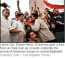 Iraqis cheering US troops