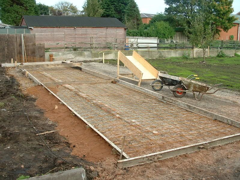  could make some wood shuttering and pour in a concrete base like this