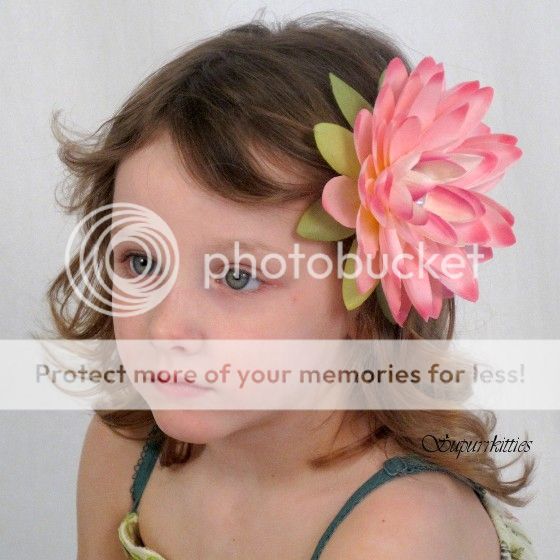   flower clip features an extra large pink water lily flower that